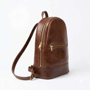 Brown Moroccan leather backpack photographed on a white background