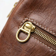 Close-up of zipper detail on brown Moroccan leather backpack