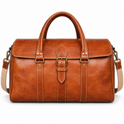 MARZAVEL cognac leather weekender duffel bag, front view of buckle flap and twin handles